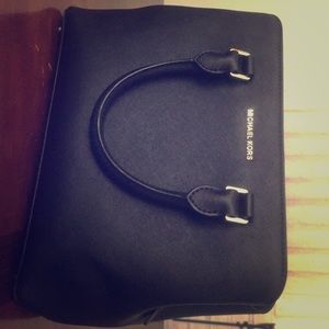 Michael Kors purse is in very good condition.